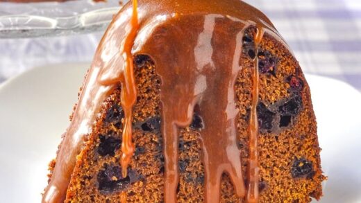 Blueberry Gingerbread Cake with Toffee Sauce close up photo of single slice