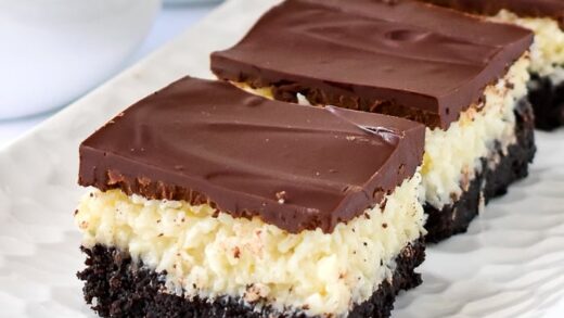 Close up photo of Coconut Bounty Cookie Bars on a white platter