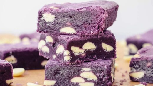 fudgy ube brownies squares with white chocolate chips.