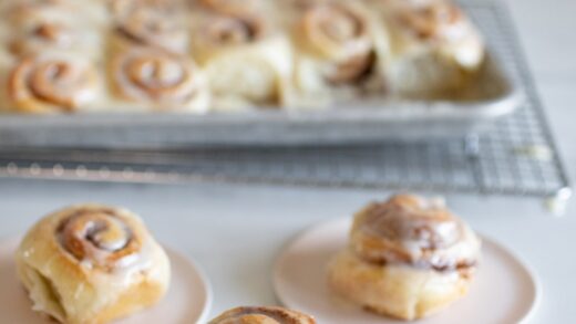 mini cinnamon rolls on pink plates