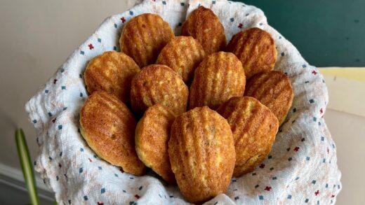 A basket of freshly baked madeleines.