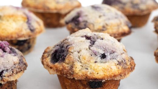 blueberry muffins on a sheet pan