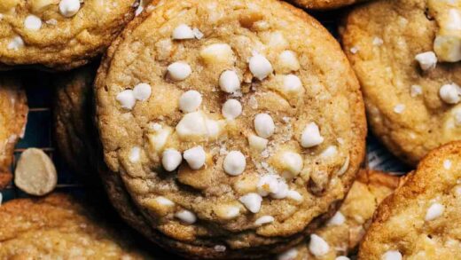 close up on the top of a white chocolate macadamia nut cookie