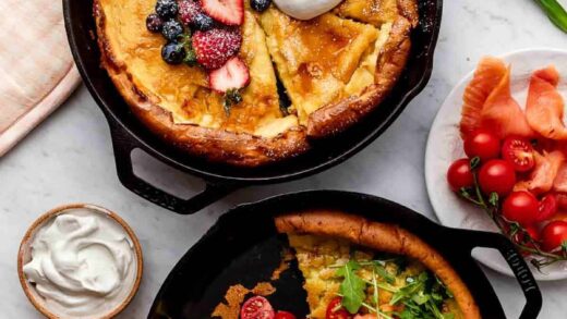 two dutch baby pancakes pictured in cast iron skillets, with one with berries and whipped cream and the other with smoked salmon and arugula.