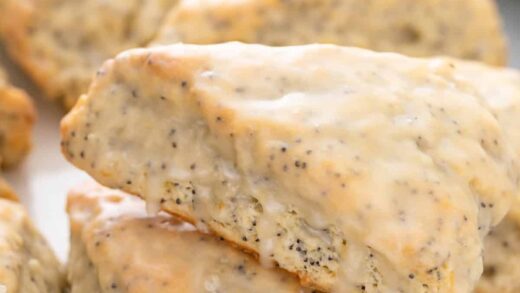 Close up of glazed lemon poppy seed scones.