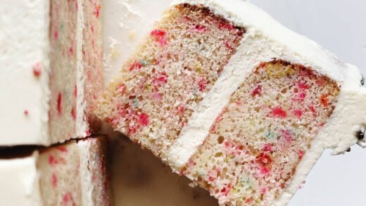 slices of confetti cake on cake stand