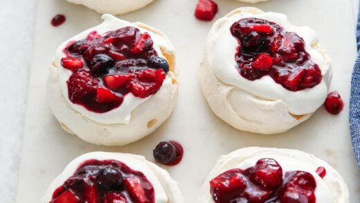 mini berry pavlovas on a serving platter